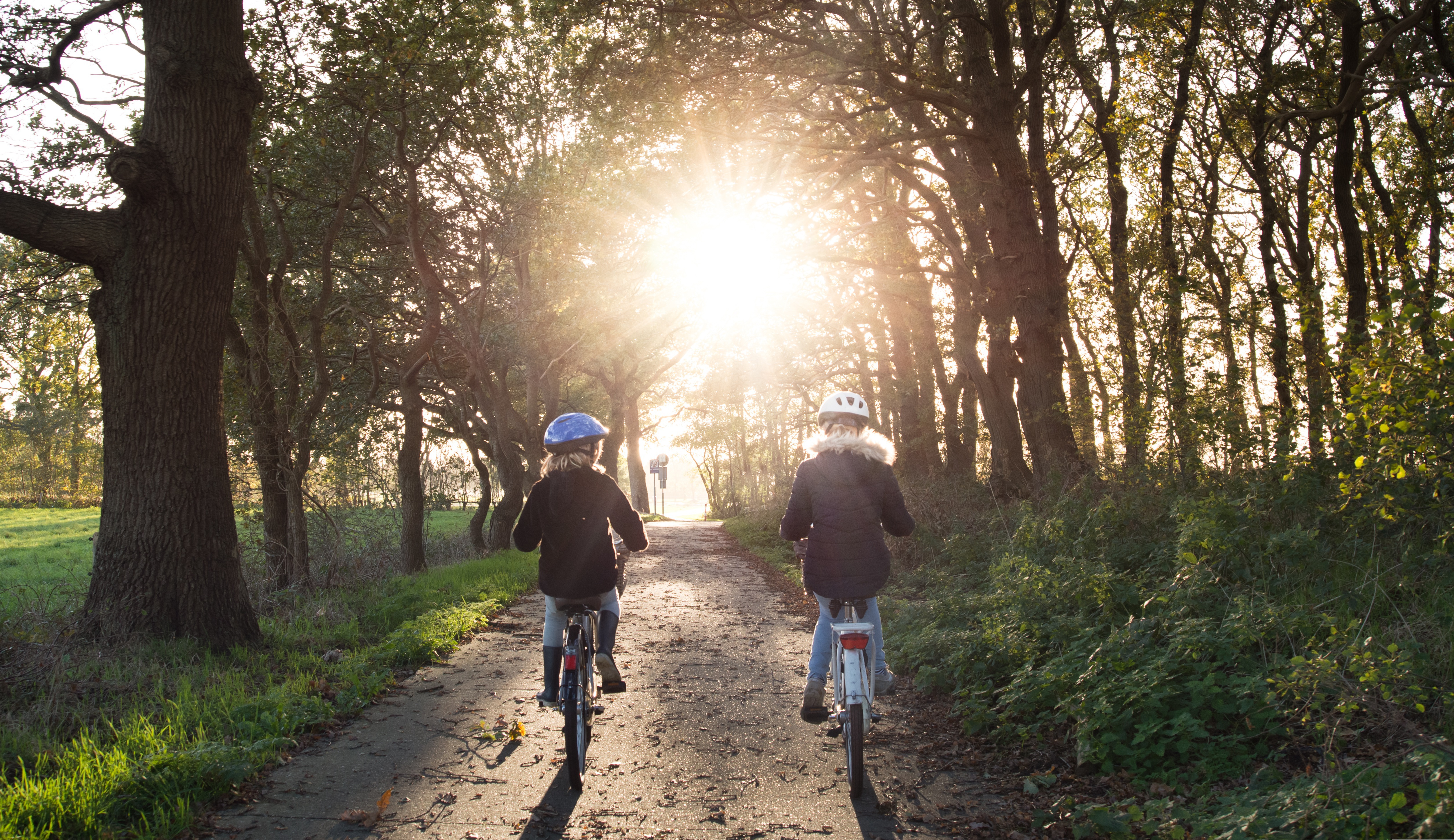 People biking through a Redding neighborhood