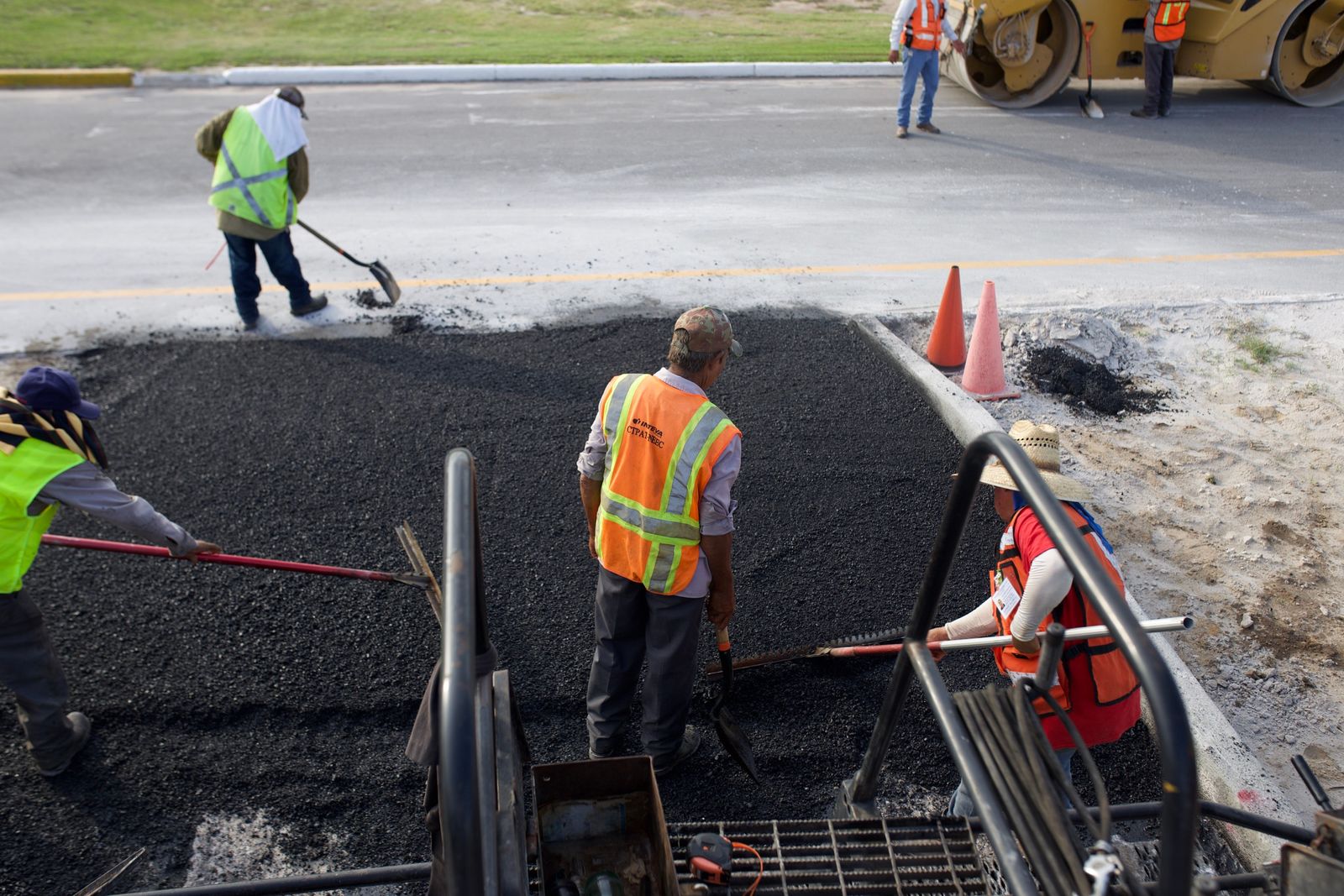 Road crew repaving a street